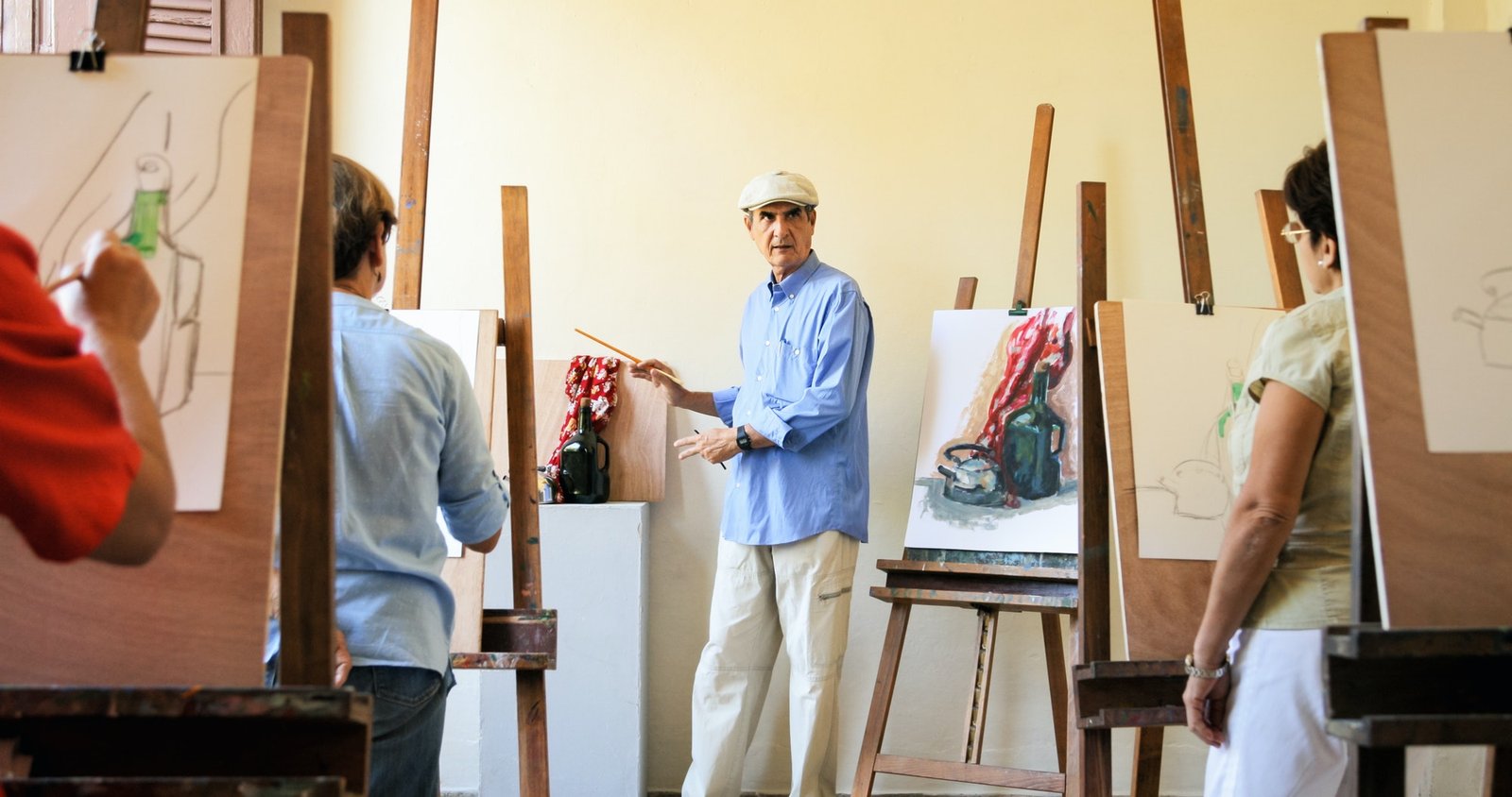 teacher-at-work-in-painting-class-with-senior-students.jpg